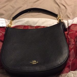 Coach black purse with tags never used.